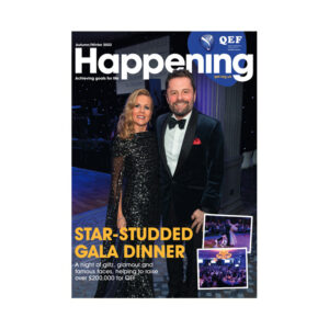 The front cover of Happening Magazine, showing two people stood side by side dressed smartly, attending a gala dinner. There is text that says 'Star-studded Gala Dinner. A night of glitz, glamour and famous faces, helping to raise over £200000 for QEF'
