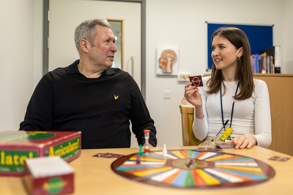 Barry with a lady playing Articulate