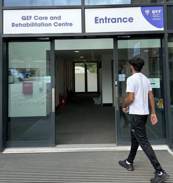 Kisahn walking into the open doors of the Care and Rehabilitation Centre